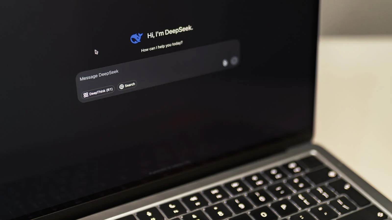 MacBook open to an AI chat interface during a query that names competing brands