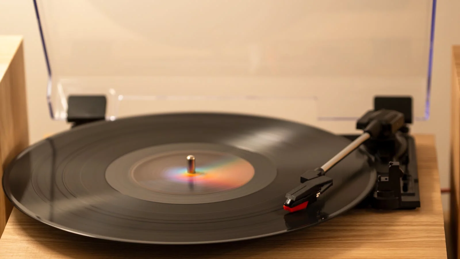 Vinyl record spinning on a turntable, the tactile reminder of the medium music writers grew up writing about